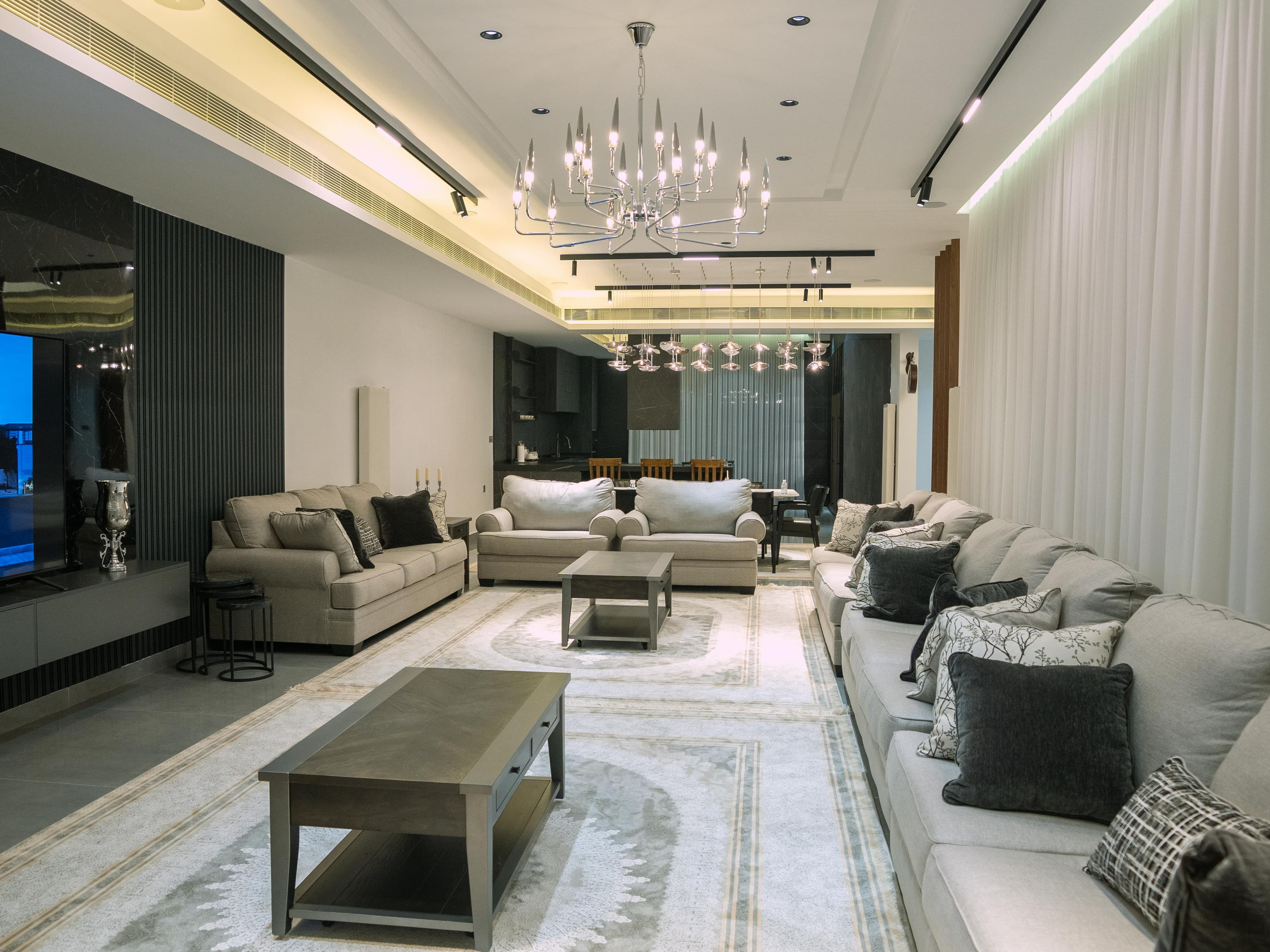Living salon with limestone floors opening to the horizon